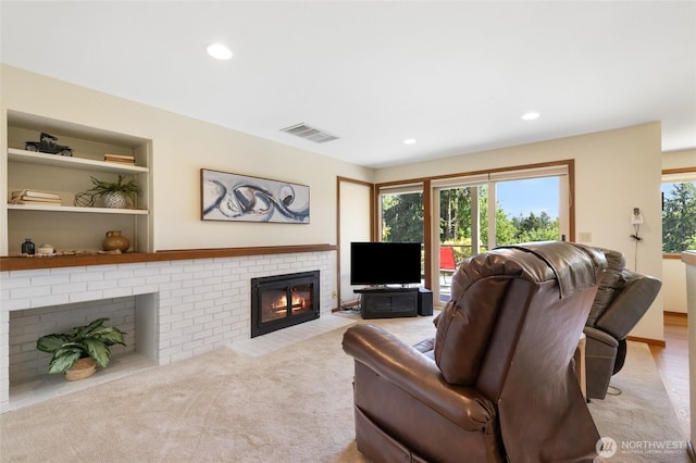 14320 2nd Ave NE, Marysville, WA 98271 - living room with a brick fireplace, recessed lighting, and light colored carpet