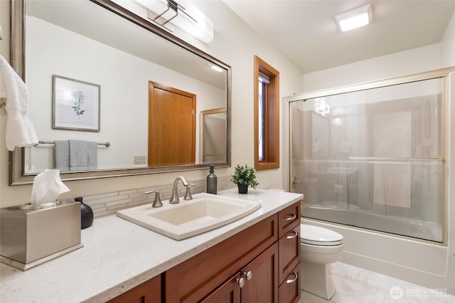 14320 2nd Ave NE, Marysville, WA 98271 - full bathroom featuring vanity, toilet, bath / shower combo with glass door, and tile patterned flooring