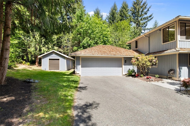14320 2nd Ave NE, Marysville, WA 98271 - view of front of home featuring an attached garage, asphalt driveway, and a front yard
