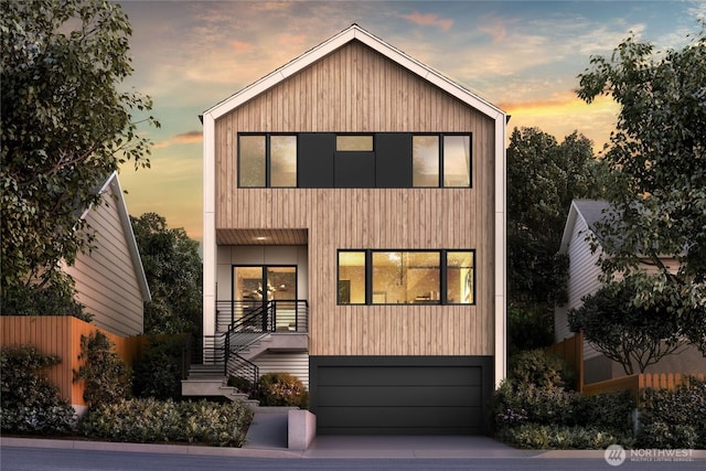 7506 18th Ave NW, Seattle, WA 98117 - contemporary home with an attached garage, driveway, and stairs