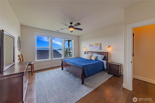 1602 Latitude Cir, Anacortes, WA 98221 - bedroom with dark wood-style flooring, baseboards, and a ceiling fan