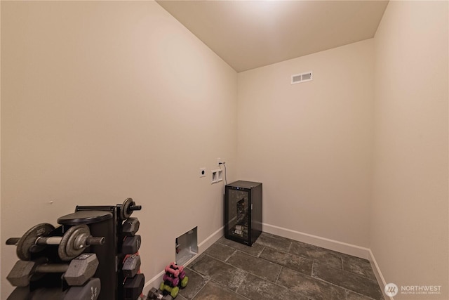 1602 Latitude Cir, Anacortes, WA 98221 - washroom with electric dryer hookup, baseboards, washer hookup, and dark stone finish flooring