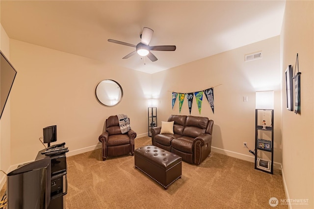 1602 Latitude Cir, Anacortes, WA 98221 - living area featuring light carpet, ceiling fan, and baseboards