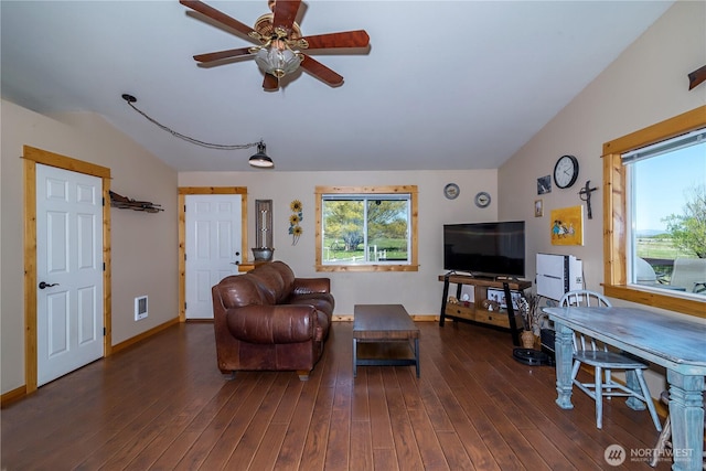 living room featuring a ceiling fan, baseboards, wood finished floors, lofted ceiling, and visible vents