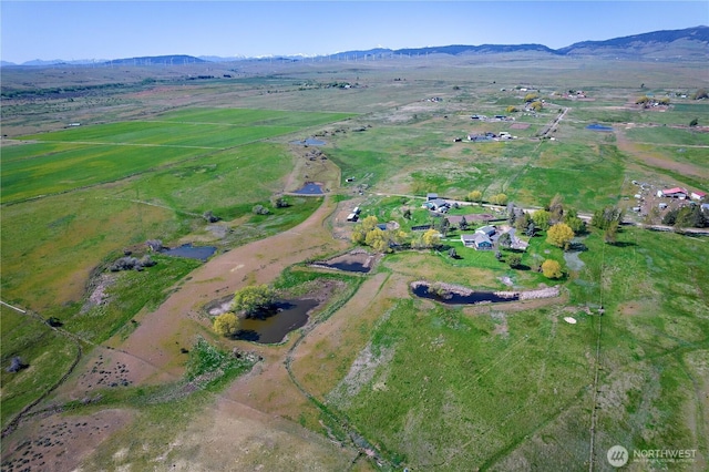 drone / aerial view with a rural view and a mountain view