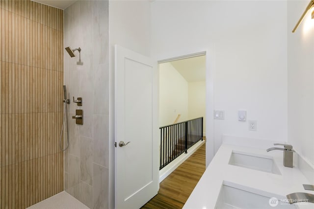 9253 6th Ave NW, Seattle, WA 98117 - bathroom with double sink, wood finished floors, and tiled shower