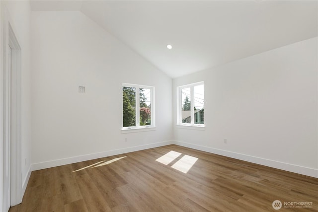 9253 6th Ave NW, Seattle, WA 98117 - unfurnished room with recessed lighting, baseboards, light wood finished floors, and high vaulted ceiling