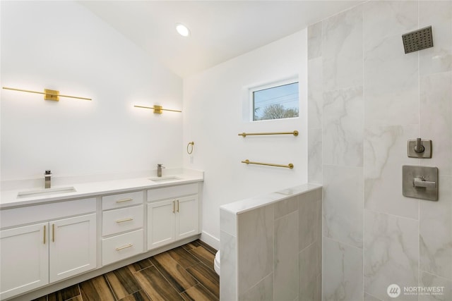 9253 6th Ave NW, Seattle, WA 98117 - bathroom with double vanity, tiled shower, a sink, and wood tiled floor