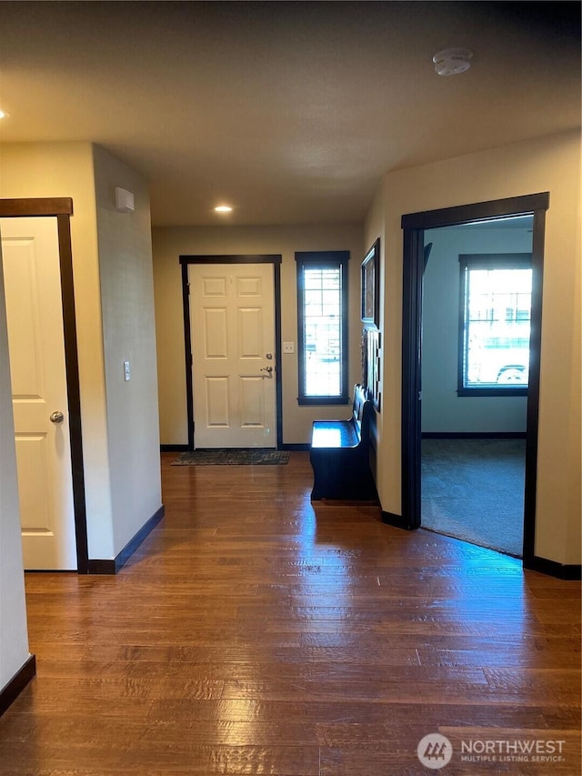 foyer entrance featuring baseboards, recessed lighting, and wood finished floors