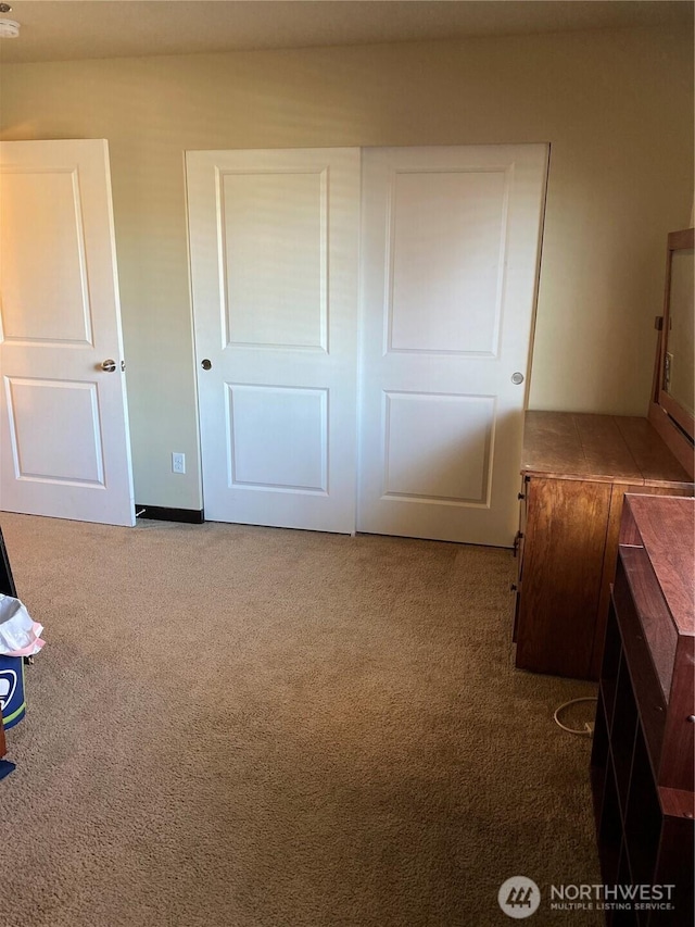 unfurnished bedroom featuring carpet floors