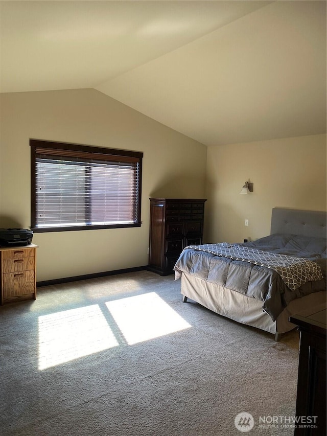 carpeted bedroom with vaulted ceiling