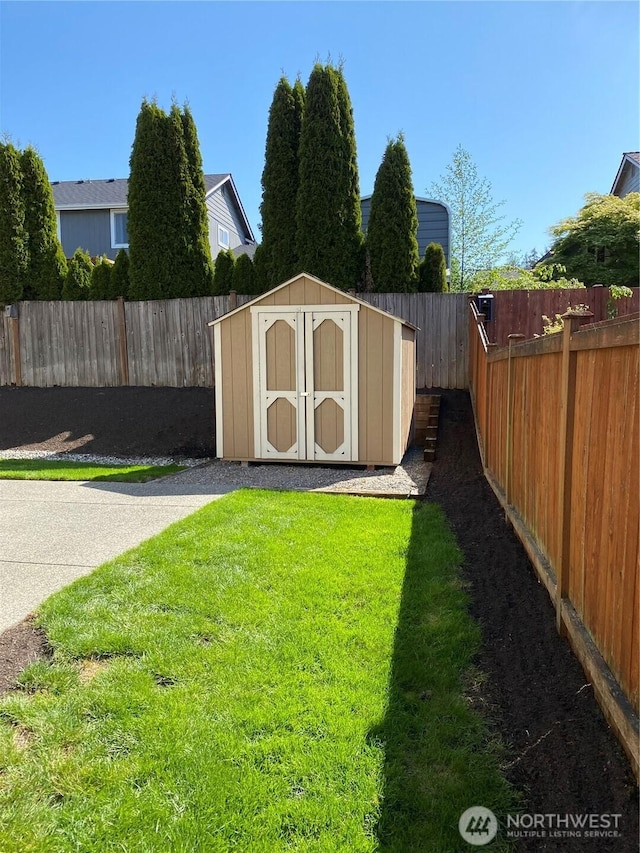 view of shed featuring a fenced backyard