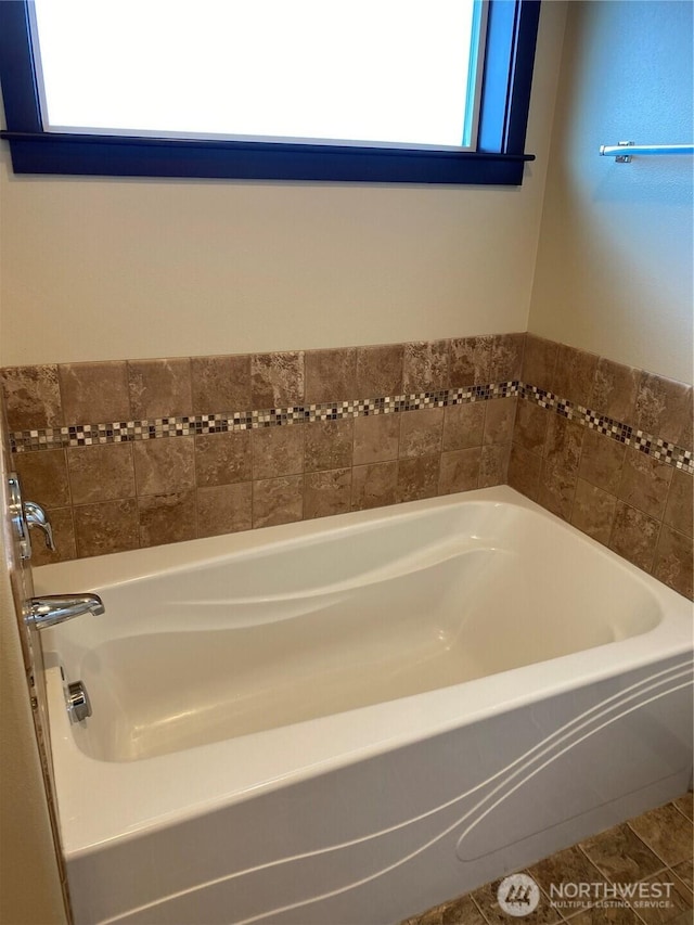 bathroom with a garden tub