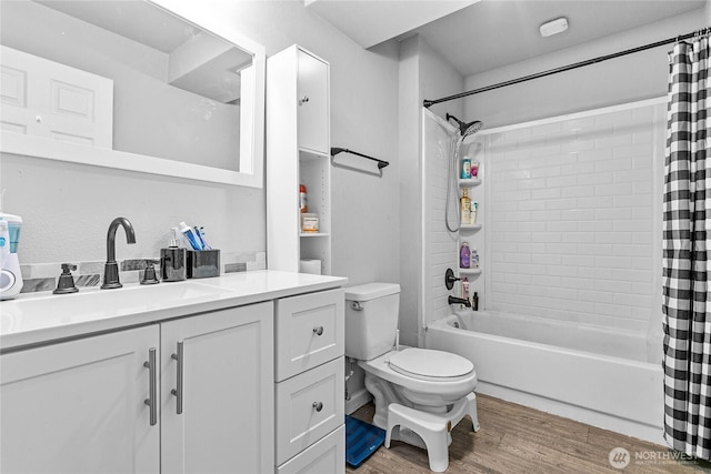 full bath featuring vanity, shower / bath combo, toilet, and wood finished floors