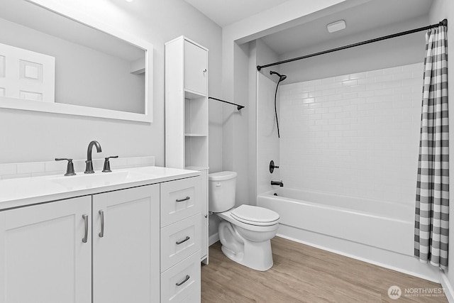 2709 Maplewood Ave Unit 304, Bellingham, WA 98225 - bathroom featuring wood finished floors, toilet, shower / tub combo with curtain, and vanity