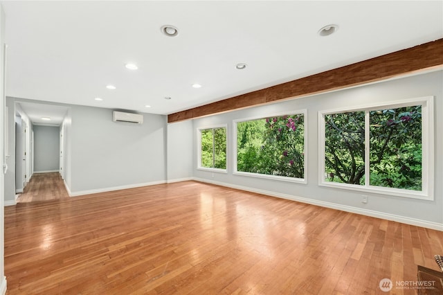 24005 SE 132nd Way, Issaquah, WA 98027 - spare room featuring plenty of natural light, baseboards, a wall unit AC, light wood-type flooring, and recessed lighting