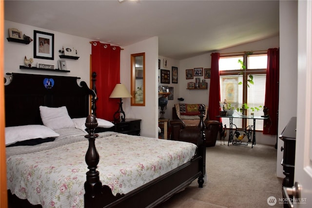 carpeted bedroom with vaulted ceiling