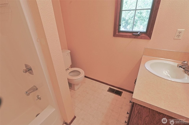 full bath with visible vents, shower / tub combination, vanity, tile patterned floors, and toilet