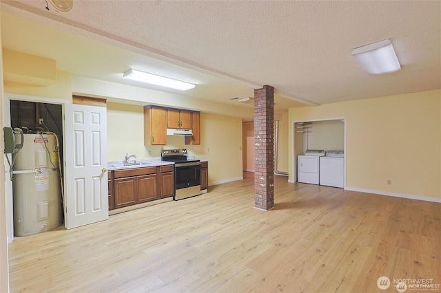kitchen featuring decorative columns, stainless steel electric range oven, a sink, under cabinet range hood, and electric water heater