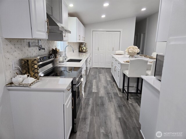 31101 116th Ave SE Unit 30, Auburn, WA 98092 - kitchen featuring stainless steel electric range, a sink, dark wood finished floors, under cabinet range hood, and white cabinets