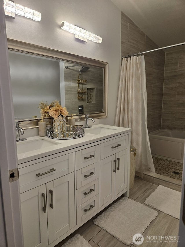 31101 116th Ave SE Unit 30, Auburn, WA 98092 - bathroom featuring tiled shower, double vanity, and wood finished floors