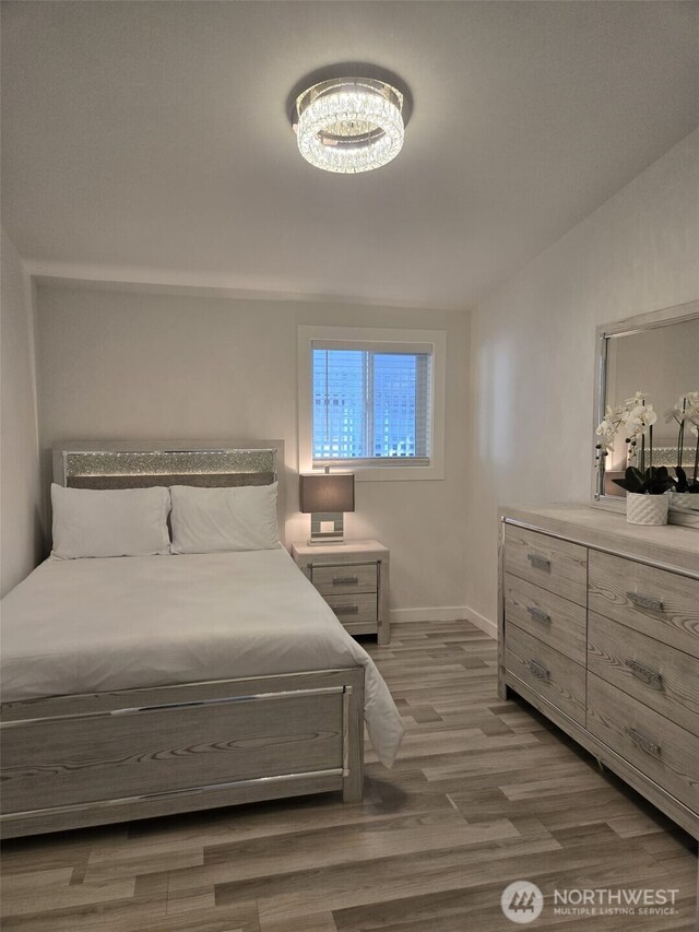 31101 116th Ave SE Unit 30, Auburn, WA 98092 - bedroom featuring wood finished floors and baseboards