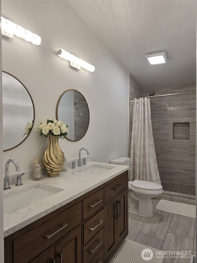 31101 116th Ave SE Unit 30, Auburn, WA 98092 - bathroom with double vanity, tiled shower, and toilet