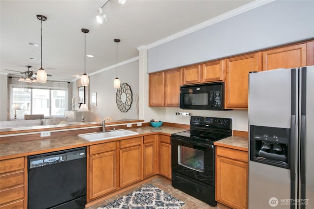 kitchen with crown molding, hanging light fixtures, a sink, black appliances, and light tile patterned flooring