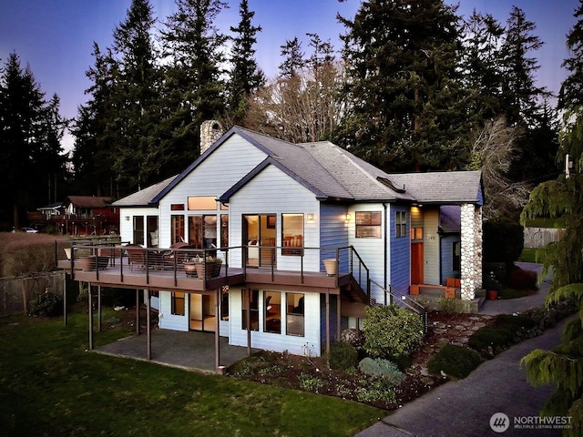 1491 Olympic Heights Ln, Freeland, WA 98249 - back of house with a lawn, a patio area, a chimney, and a deck