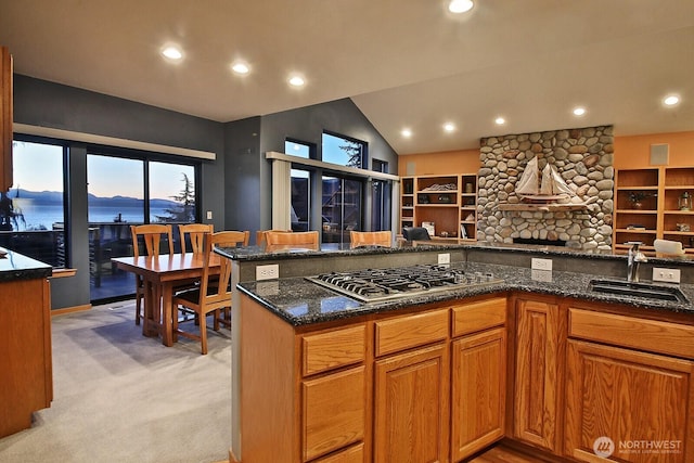 1491 Olympic Heights Ln, Freeland, WA 98249 - kitchen featuring light carpet, open floor plan, a sink, dark stone countertops, and stainless steel gas stovetop