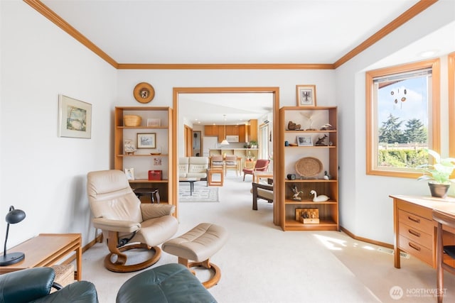 sitting room featuring crown molding, baseboards, and carpet floors