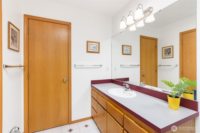 bathroom featuring vanity and baseboards