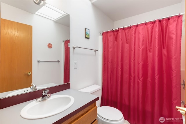 full bathroom with vanity, a shower with curtain, and toilet