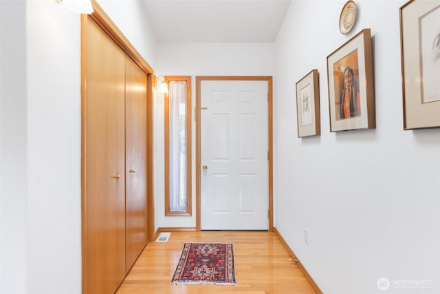 doorway with visible vents and light wood-type flooring