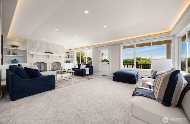 6117 92nd St SW, Mukilteo, WA 98275 - living room with carpet, recessed lighting, built in shelves, and a brick fireplace