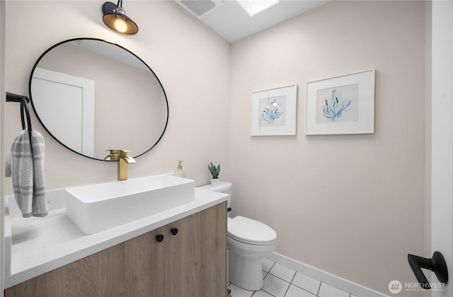 6117 92nd St SW, Mukilteo, WA 98275 - half bath with toilet, tile patterned flooring, vanity, and baseboards