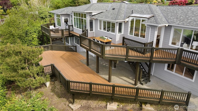 6117 92nd St SW, Mukilteo, WA 98275 - rear view of house with a shingled roof, a deck, and a chimney