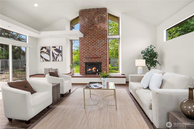 11815 77th Ave S, Seattle, WA 98178 - living room featuring wood finished floors, a fireplace, and high vaulted ceiling