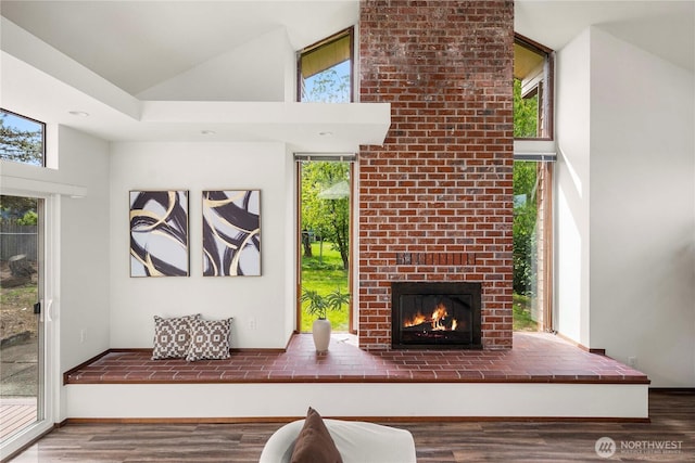 11815 77th Ave S, Seattle, WA 98178 - living area featuring wood finished floors, a brick fireplace, and high vaulted ceiling