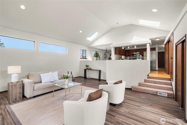 11815 77th Ave S, Seattle, WA 98178 - living room with a skylight, wood finished floors, lofted ceiling, recessed lighting, and stairway