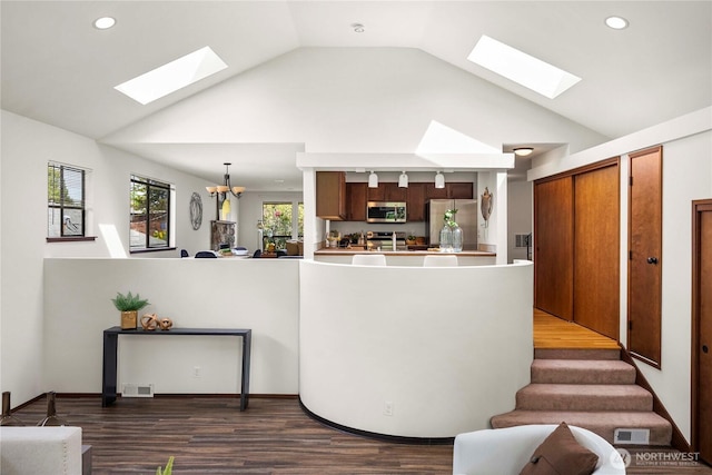 11815 77th Ave S, Seattle, WA 98178 - interior space with a skylight, recessed lighting, dark wood finished floors, a chandelier, and high vaulted ceiling