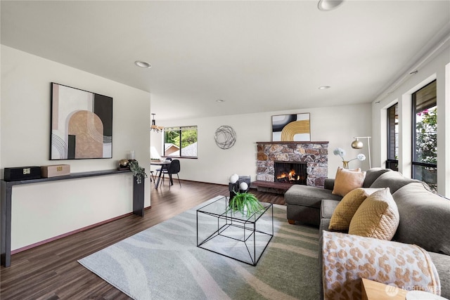 11815 77th Ave S, Seattle, WA 98178 - living room featuring dark wood finished floors, a stone fireplace, and recessed lighting