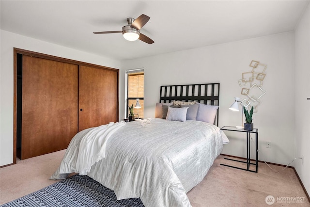 11815 77th Ave S, Seattle, WA 98178 - bedroom with light colored carpet, a closet, and a ceiling fan