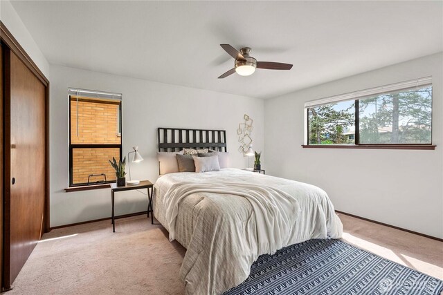 11815 77th Ave S, Seattle, WA 98178 - bedroom featuring light carpet, baseboards, ceiling fan, and a closet