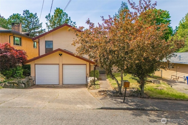11815 77th Ave S, Seattle, WA 98178 - view of front facade with a garage and driveway