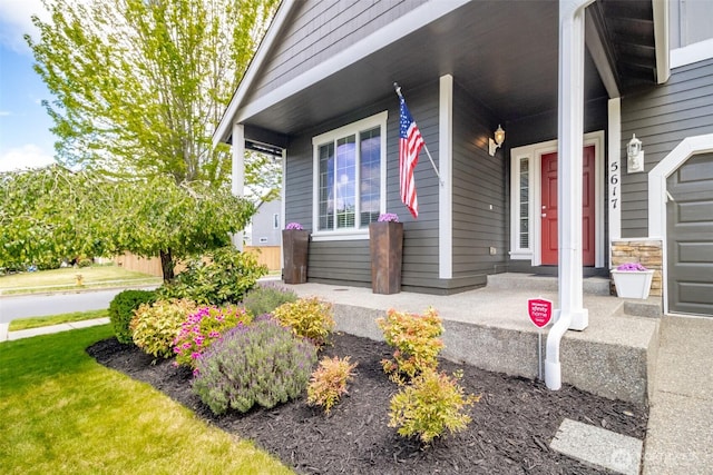 doorway to property featuring covered porch