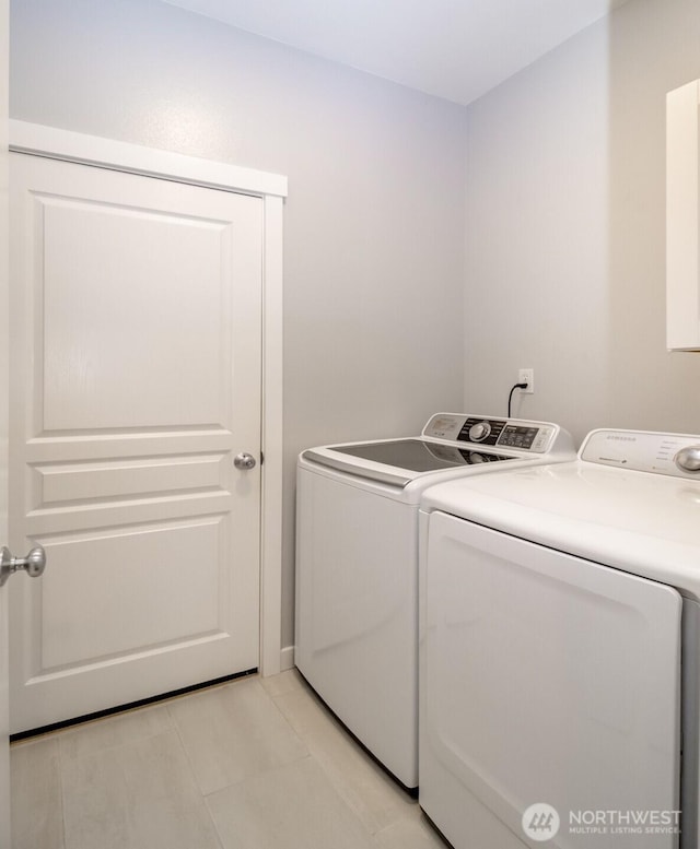 laundry room with washer and dryer