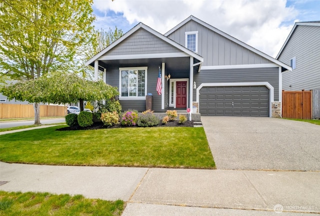 craftsman inspired home featuring an attached garage, concrete driveway, board and batten siding, and stone siding
