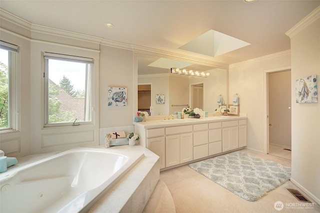 bathroom featuring visible vents, a sink, a whirlpool tub, and double vanity