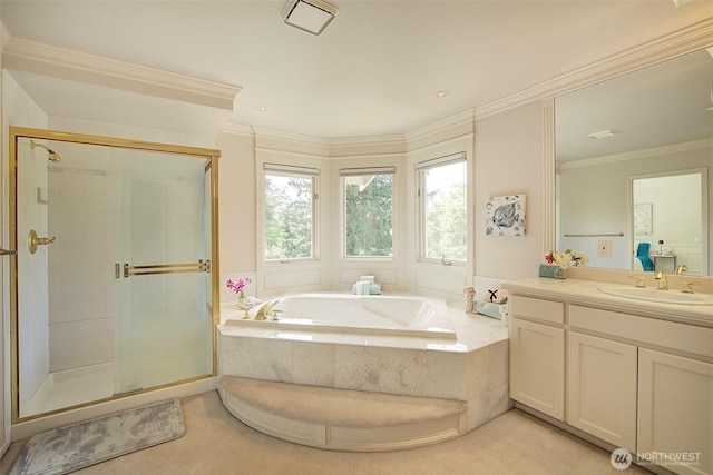 full bath with vanity, ornamental molding, a shower stall, and a garden tub
